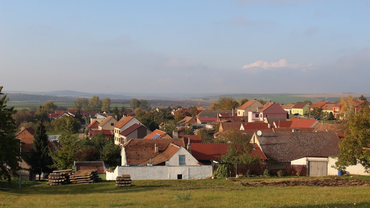 brown and white houses under white sky during daytime
